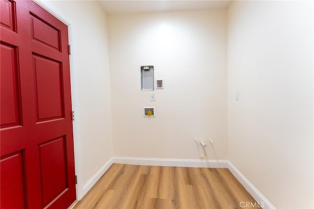 1532 W 22nd St, Los Angeles, CA 90007 - washroom featuring light wood-style flooring, washer hookup, and baseboards