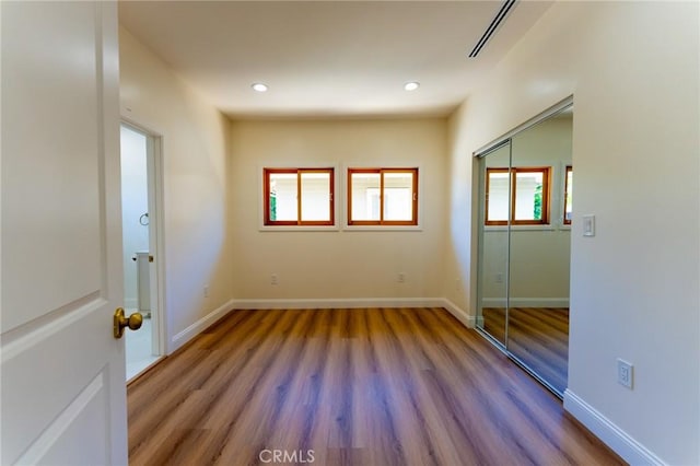 1532 W 22nd St, Los Angeles, CA 90007 - empty room with wood finished floors, recessed lighting, and baseboards