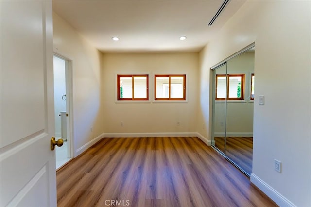 1532 W 22nd St, Los Angeles, CA 90007 - unfurnished bedroom featuring wood finished floors, a closet, and recessed lighting