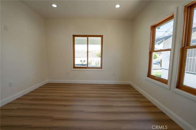 1532 W 22nd St, Los Angeles, CA 90007 - spare room featuring recessed lighting, wood finished floors, and baseboards