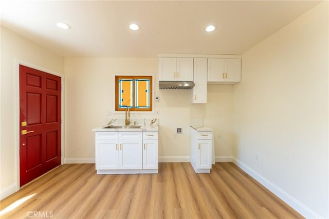 1532 W 22nd St, Los Angeles, CA 90007 - laundry room featuring a sink, light wood-type flooring, baseboards, and recessed lighting