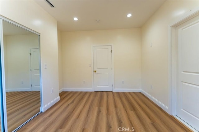 1532 W 22nd St, Los Angeles, CA 90007 - empty room with light wood finished floors and recessed lighting