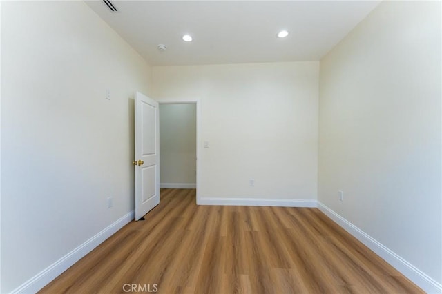 1532 W 22nd St, Los Angeles, CA 90007 - empty room with light wood-style floors, recessed lighting, and baseboards