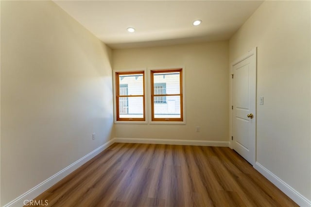 1532 W 22nd St, Los Angeles, CA 90007 - spare room with wood finished floors, recessed lighting, and baseboards