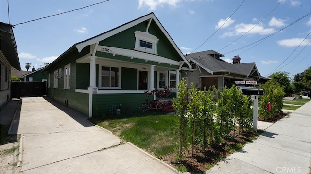 1532 W 22nd St, Los Angeles, CA 90007 - bungalow-style house with fence and a porch