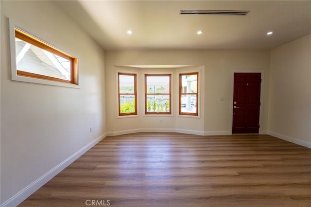 1532 W 22nd St, Los Angeles, CA 90007 - spare room featuring wood finished floors and recessed lighting