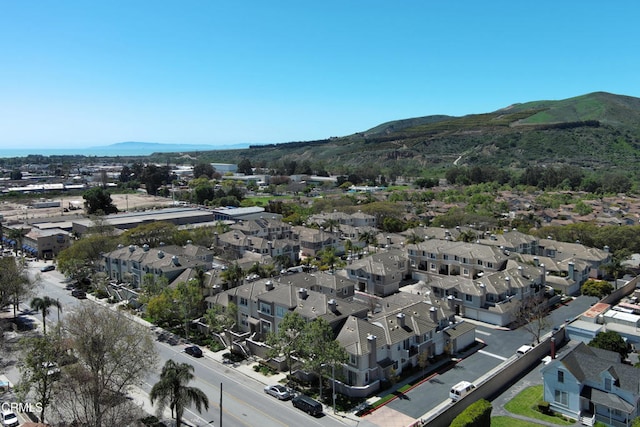 aerial view featuring a mountain view and a residential view
