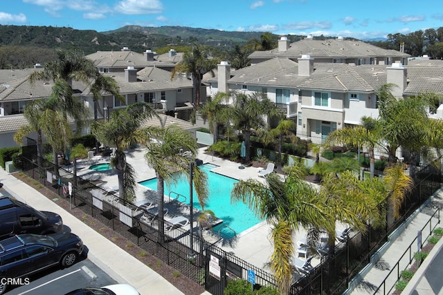 aerial view featuring a mountain view and a residential view