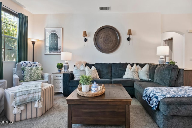 living area with carpet and visible vents