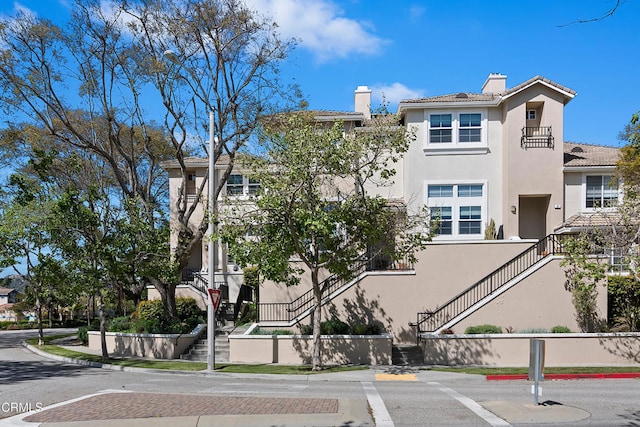 view of property with stairway