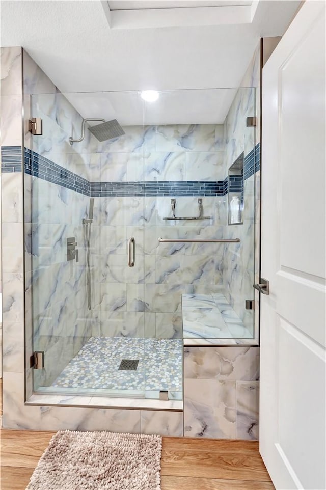 13110 Seaview Ln Unit 245F, Seal Beach, CA 90740 - bathroom featuring a stall shower and wood finished floors