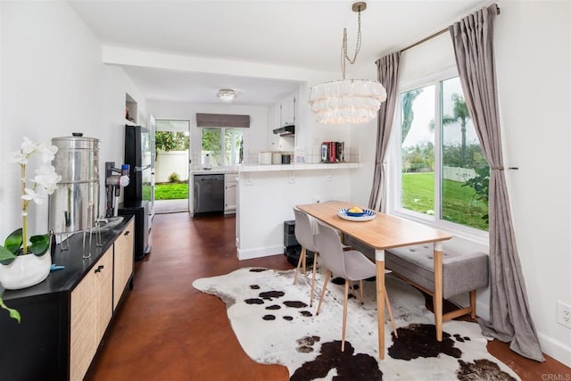 328 Countrywood Ln, Encinitas, CA 92024 - dining space with finished concrete flooring and a chandelier