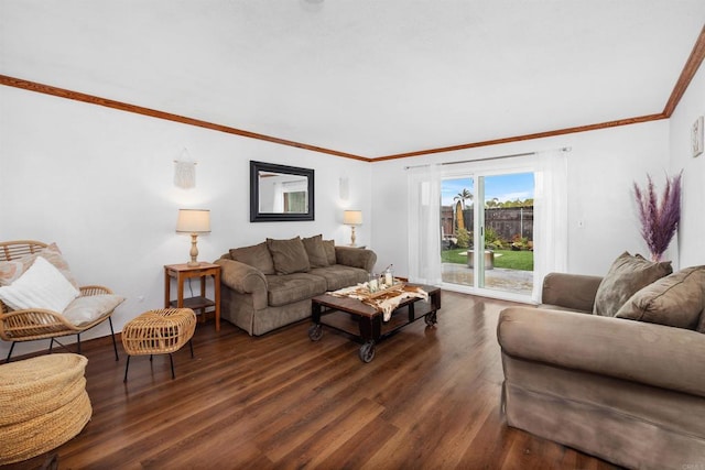 living room featuring dark wood-type flooring and crown molding