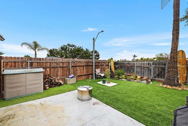 view of yard with a fenced backyard and a patio area