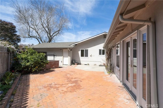 view of patio featuring fence
