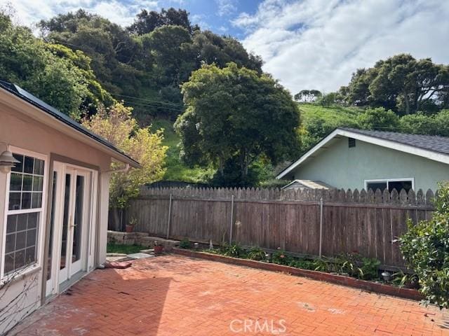 view of patio / terrace featuring fence