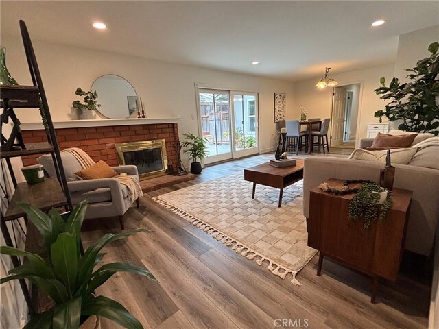 508 Launa Ln, Arroyo Grande, CA 93420 - living room featuring wood finished floors, recessed lighting, and a brick fireplace