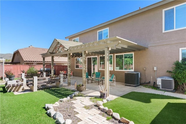 27089 Adelanto Dr, Corona, CA 92883 - rear view of property featuring stucco siding, a pergola, central air condition unit, and fence