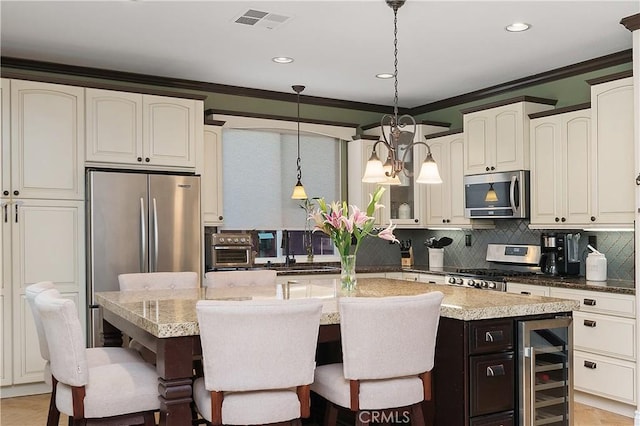 27089 Adelanto Dr, Corona, CA 92883 - kitchen with a kitchen breakfast bar, stainless steel appliances, wine cooler, visible vents, and decorative backsplash