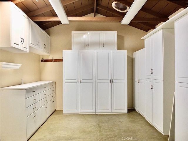 220 Roycroft Ave, Long Beach, CA 90803 - kitchen with wooden ceiling, white cabinets, light carpet, and light countertops