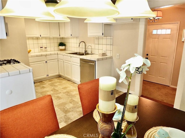220 Roycroft Ave, Long Beach, CA 90803 - kitchen with tile counters, dishwasher, white cabinets, tasteful backsplash, and light floors