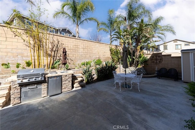 15686 Iron Spring Ln, Fontana, CA 92336 - fenced backyard featuring a patio area, area for grilling, and outdoor dining area