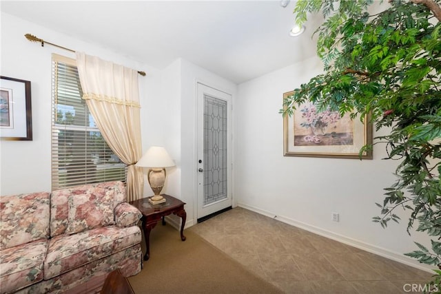 15686 Iron Spring Ln, Fontana, CA 92336 - sitting room with baseboards and tile patterned floors