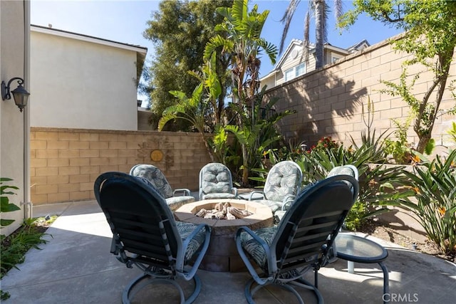 15686 Iron Spring Ln, Fontana, CA 92336 - view of patio / terrace with a fire pit