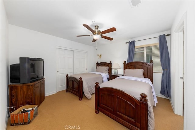 15686 Iron Spring Ln, Fontana, CA 92336 - bedroom with light colored carpet, a closet, and ceiling fan