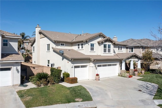 15686 Iron Spring Ln, Fontana, CA 92336 - view of front of house with an attached garage, stucco siding, concrete driveway, a tiled roof, and a front lawn