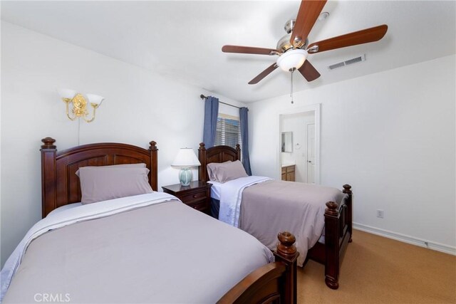 15686 Iron Spring Ln, Fontana, CA 92336 - bedroom featuring light carpet, a ceiling fan, and ensuite bathroom