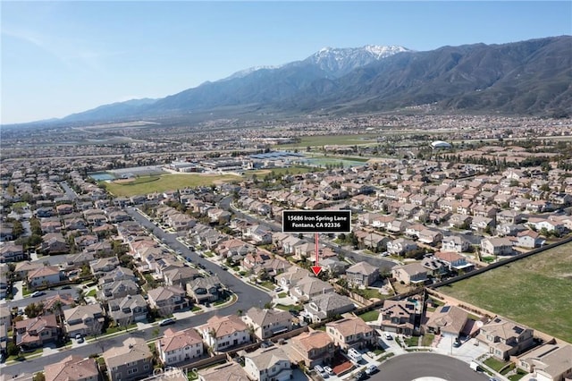 15686 Iron Spring Ln, Fontana, CA 92336 - aerial overview of property's location with nearby suburban area