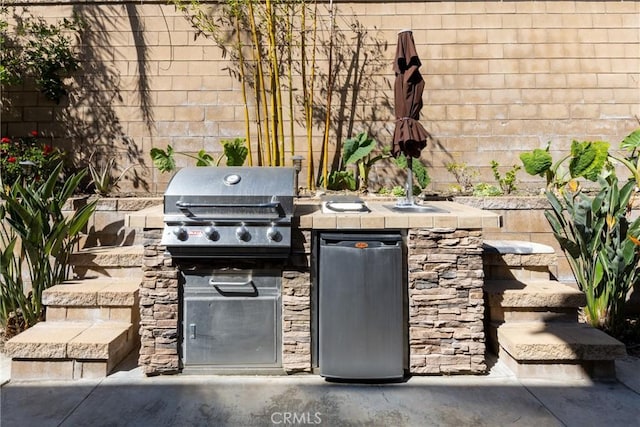 15686 Iron Spring Ln, Fontana, CA 92336 - view of patio / terrace with an outdoor kitchen