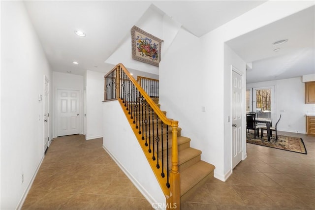 15686 Iron Spring Ln, Fontana, CA 92336 - staircase featuring recessed lighting and tile patterned floors