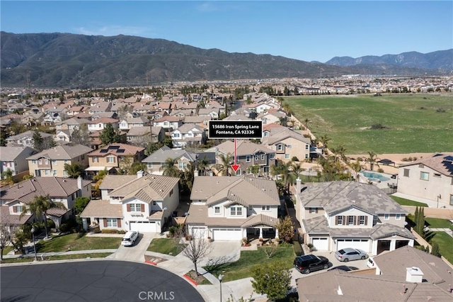 15686 Iron Spring Ln, Fontana, CA 92336 - aerial perspective of suburban area with mountains