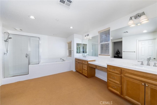 15686 Iron Spring Ln, Fontana, CA 92336 - bathroom featuring vanity, a garden tub, a stall shower, and recessed lighting