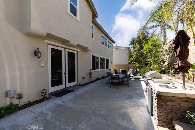 15686 Iron Spring Ln, Fontana, CA 92336 - view of patio / terrace featuring area for grilling, outdoor dining space, and french doors