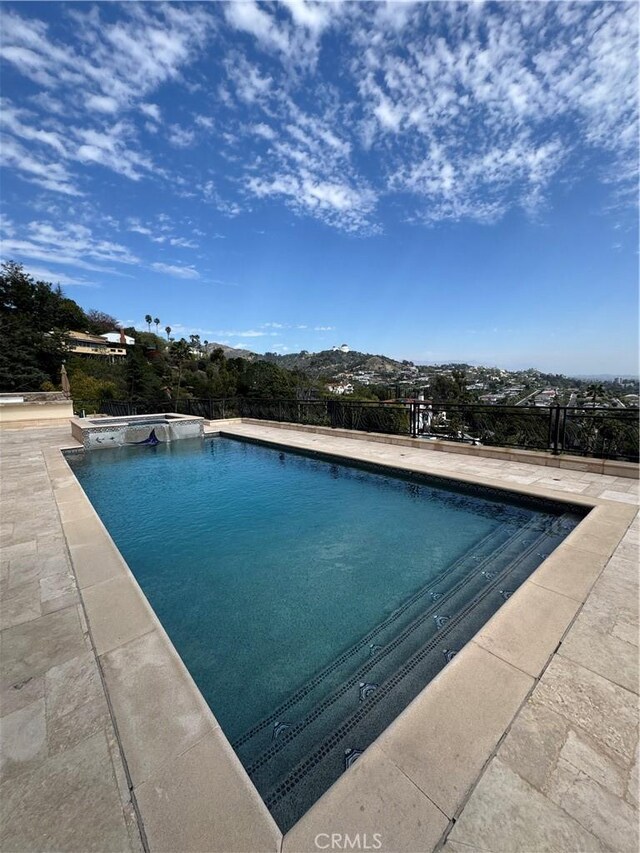 2025 E Live Oak Dr, Los Angeles, CA 90068 - view of swimming pool featuring a pool with connected hot tub and a patio area