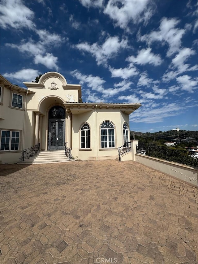 2025 E Live Oak Dr, Los Angeles, CA 90068 - mediterranean / spanish house with a tile roof and stucco siding