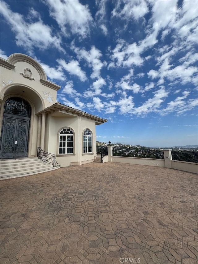 2025 E Live Oak Dr, Los Angeles, CA 90068 - exterior space featuring stucco siding and a tile roof