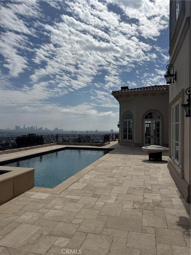 2025 E Live Oak Dr, Los Angeles, CA 90068 - view of swimming pool with fence, a patio area, french doors, and a fenced in pool