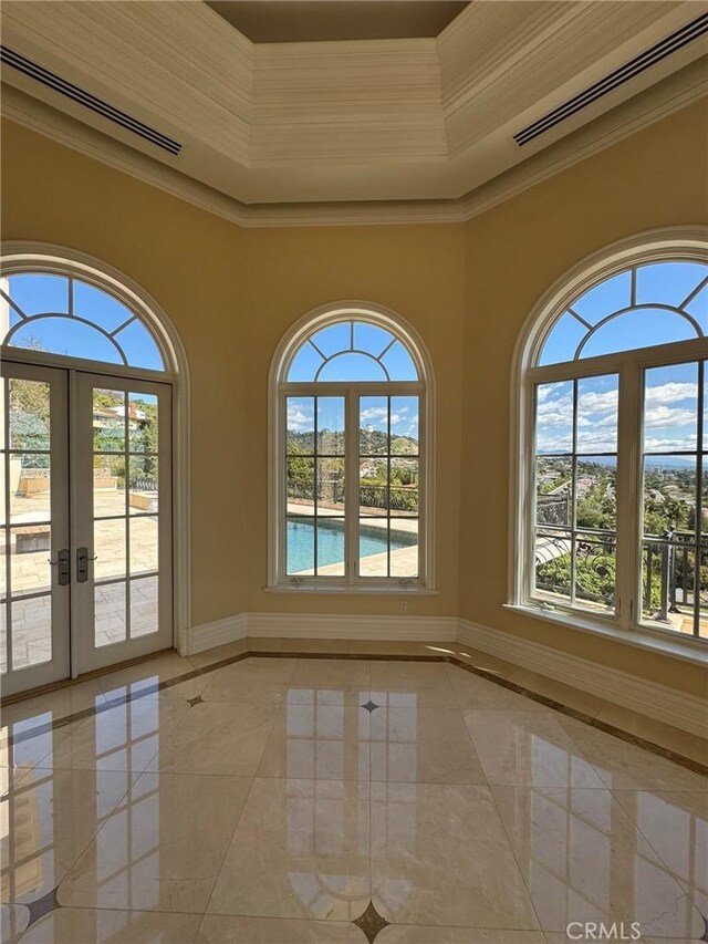 2025 E Live Oak Dr, Los Angeles, CA 90068 - empty room with visible vents, crown molding, baseboards, marble finish floor, and french doors