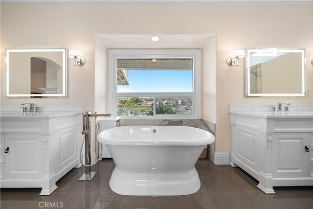 25252 Manzanita Dr, Dana Point, CA 92629 - full bath with two vanities, a freestanding tub, and tile patterned floors