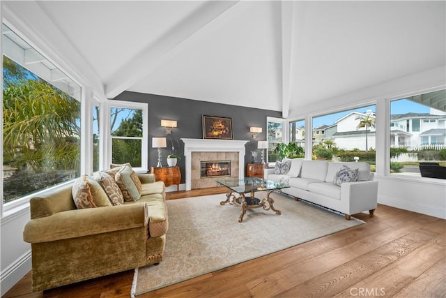sunroom / solarium featuring beamed ceiling
