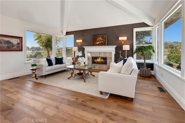 25252 Manzanita Dr, Dana Point, CA 92629 - living room featuring a tiled fireplace, baseboards, and wood finished floors