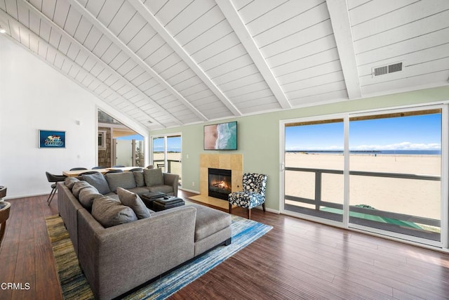 3371 Ocean Dr, Oxnard, CA 93035 - living room featuring a healthy amount of sunlight, visible vents, beam ceiling, and a fireplace
