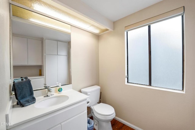 3371 Ocean Dr, Oxnard, CA 93035 - bathroom featuring toilet, vanity, baseboards, and wood finished floors