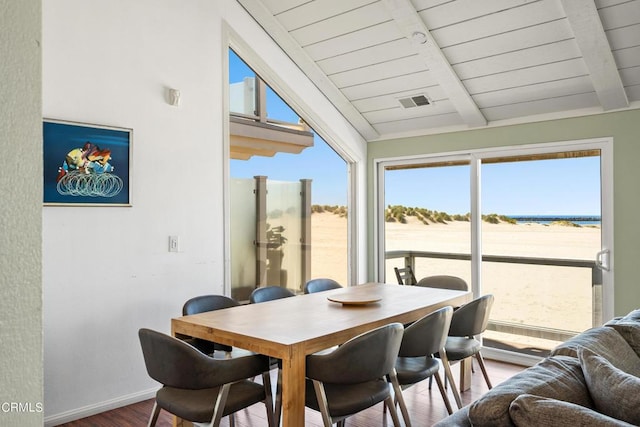 3371 Ocean Dr, Oxnard, CA 93035 - dining space featuring wood ceiling, vaulted ceiling with beams, wood finished floors, baseboards, and visible vents