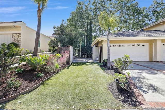 22839 Ridge Route Ln, Lake Forest, CA 92630 - view of side of home with stucco siding, an attached garage, concrete driveway, and a lawn