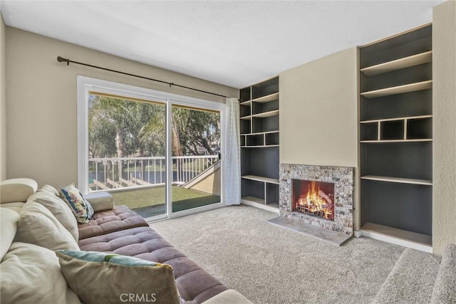 22839 Ridge Route Ln, Lake Forest, CA 92630 - living room with built in features, carpet floors, and a lit fireplace